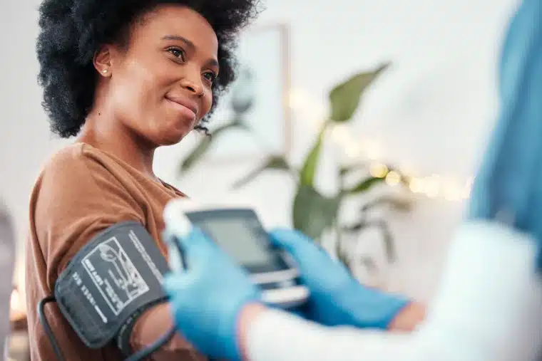 Woman having her blood pressure checked